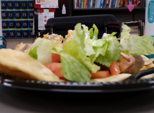 The glimmering of the fresh veggies imbeded in a delectable gyro