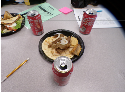 Shows the balance between thee cloud drink to thee hot gyro. has the higher view to see all of the food.
