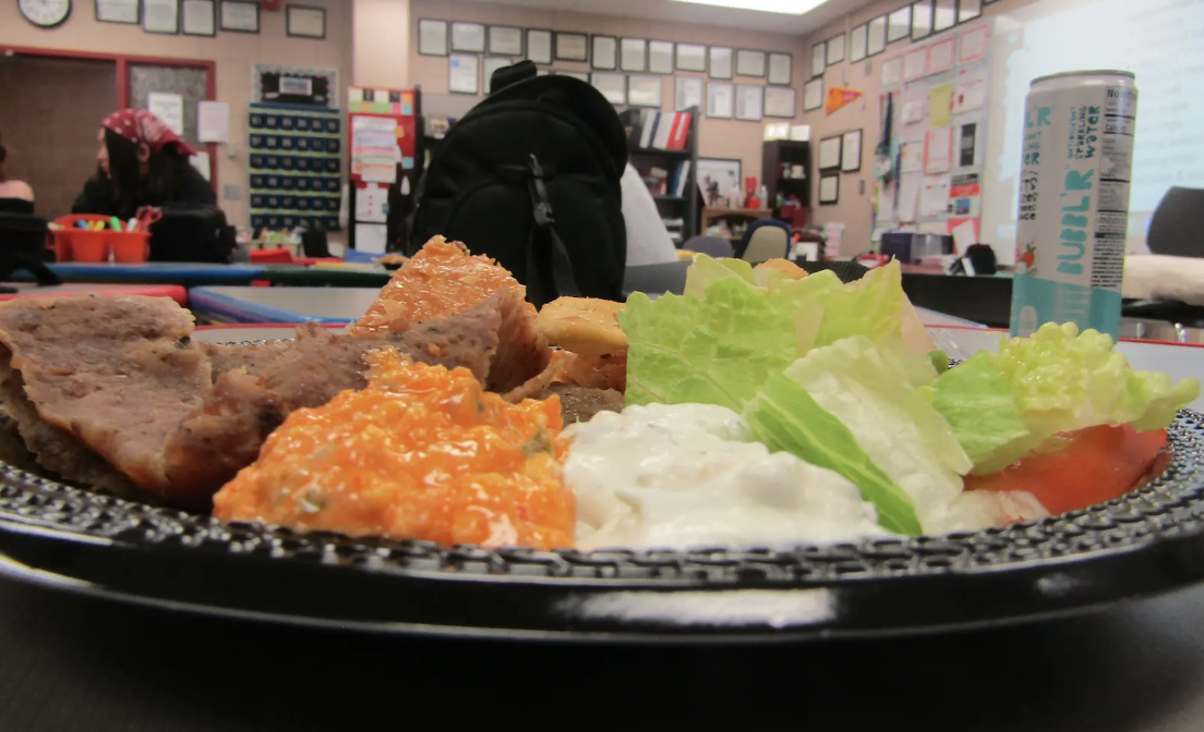 This plate highlights the variety offered at Dino’s, from crisp vegetables to warm pita chips.