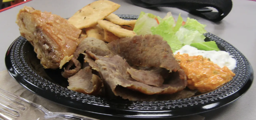 Dino’s serves its gyro platter with classic Mediterranean sides and a sweet finish.