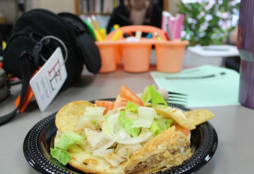 The food shows all the main ingredients of the gyro, while still presenting an visually pleasing balance across the plate. 