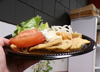 Another interesting way to look at a plate of food not on a table but picked up on a hand. The plate's weight felt like it was going to fix an empty stomach with all the ingredients.