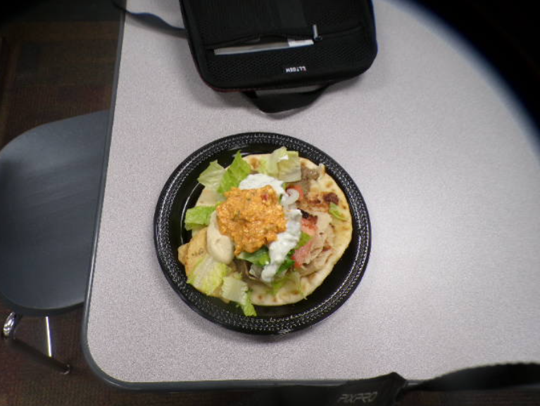 This dish allows the audience to focus on the beauty of the plated dish while allowing them to get a great lookout on the variety of tasty ingredients being blended together from fresh veggies to crunchy salted pita chips, all are delicious. 