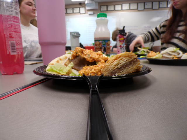 Plate full of delicious food from Dino's Gyros. Savory gyro and sweet baklava, the perfect mix for your taste buds. 