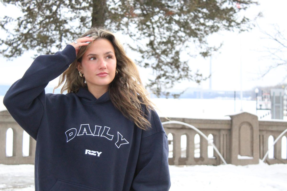 Senior Rosie Druffner posing in the wind to promote RZY Wear.