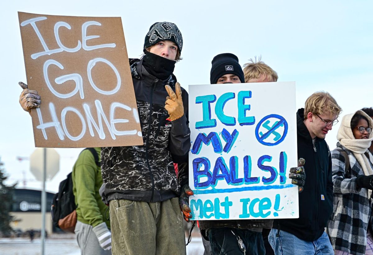 Students walking out with signs to protest ICE in Minnesota