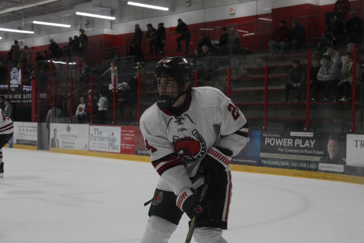 Sophomore Brandon Dustin warming up at the goal, shaking off his nerves
