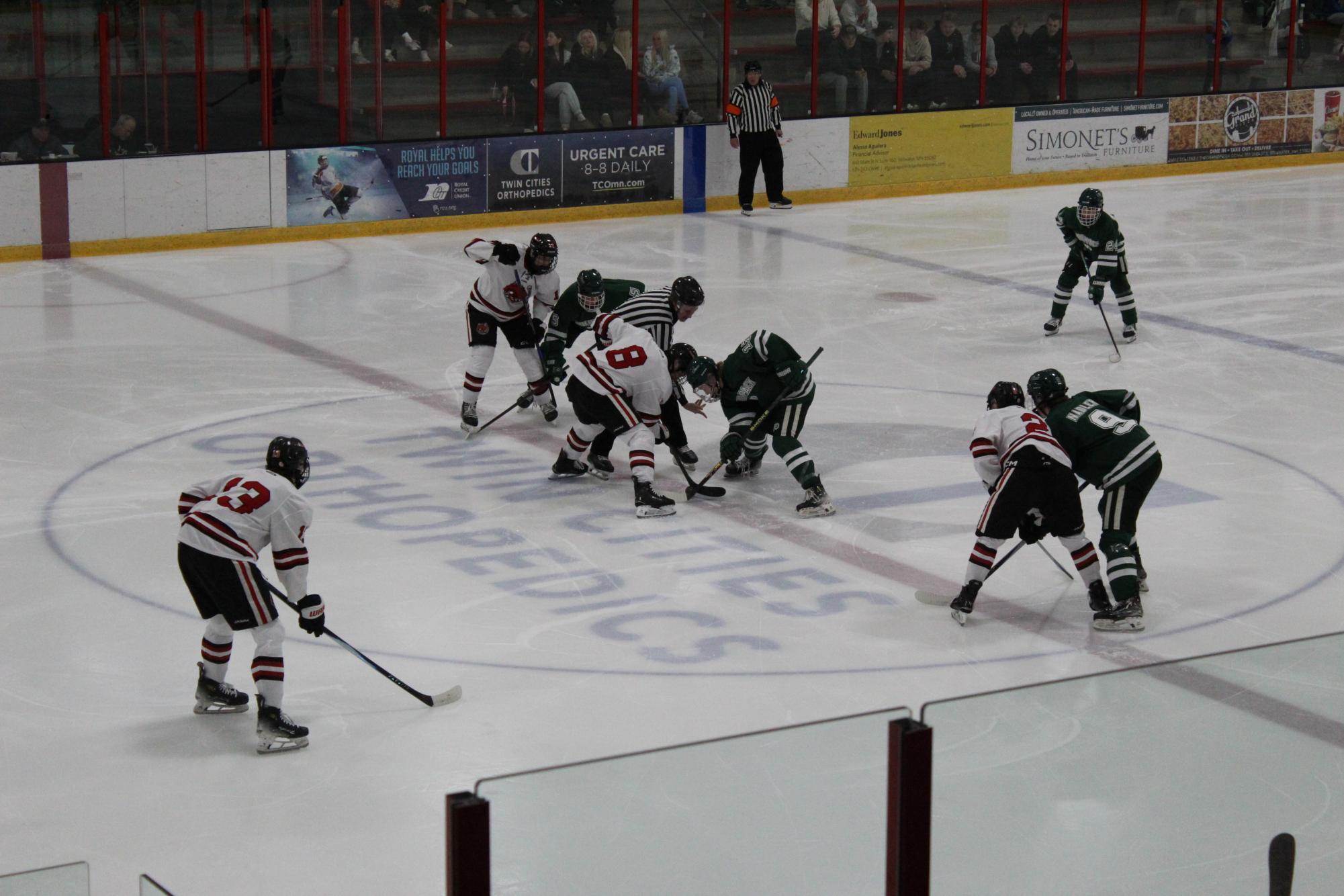 Stillwater waiting for the ref to drop the puck to start the game off strong
