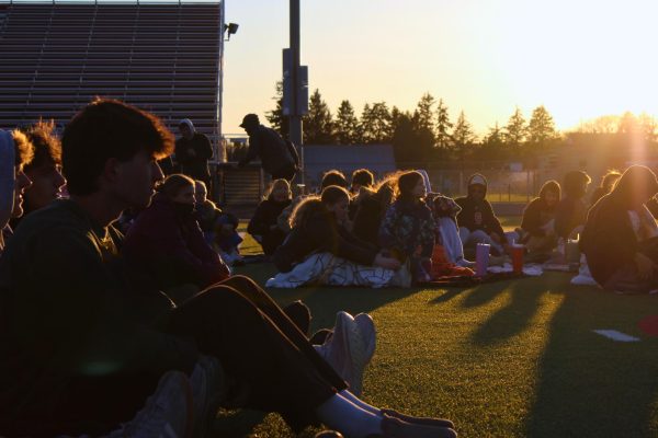 Students gather at Pony Stadium for Fields of Faith, while wrapped tight in blankets. 